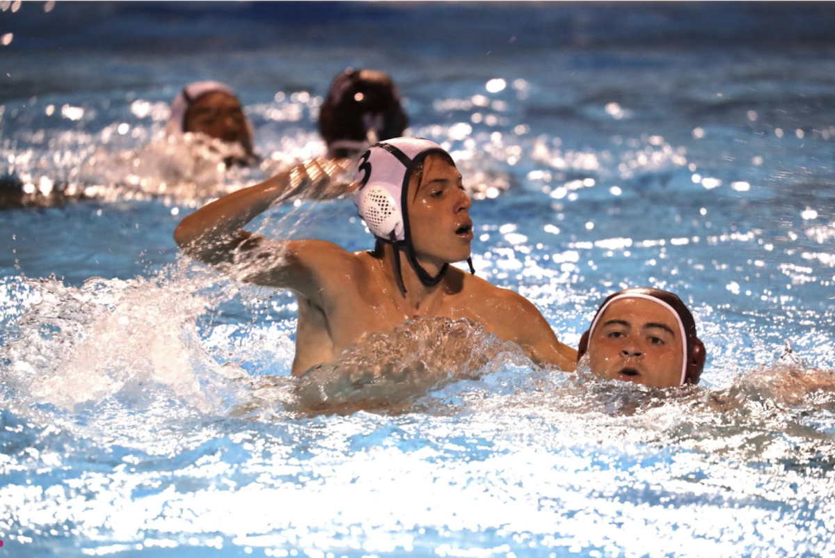 Junior Alberto Escobedo tries to steal the ball from the opposing team. Escobedo has played Water Polo throughout his entire high school career. According to Escobedo, hes excited for the new season that awaits him.
